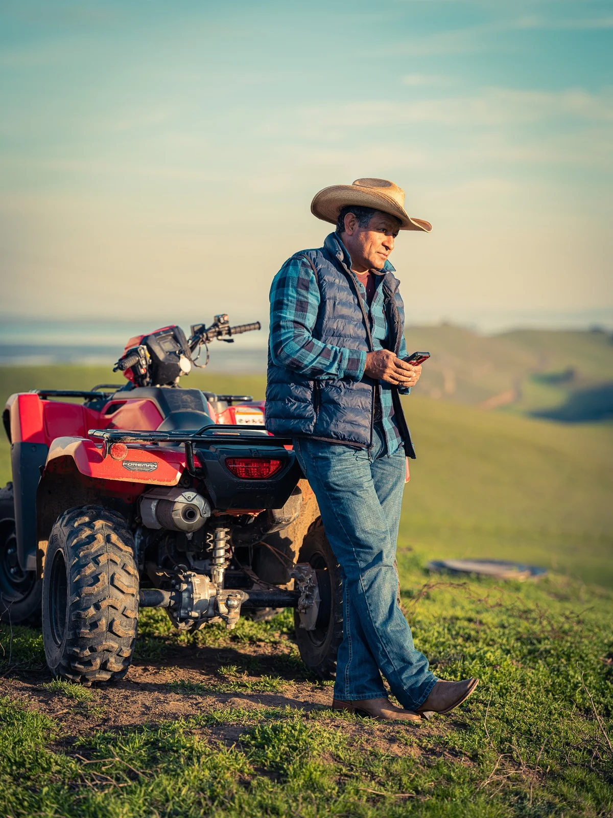 Technician on ATV inspecting rural network equipment for Valley Internet in Suisun Valley.